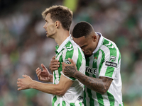 Natan Bernardo de Souza of Real Betis and Diego Llorente of Real Betis celebrate winning during the La Liga EA Sports match between Real Bet...