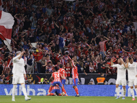 Several players of Atletico de Madrid celebrate a goal during the La Liga 2024/25 match between Atletico de Madrid and Real Madrid at Civita...