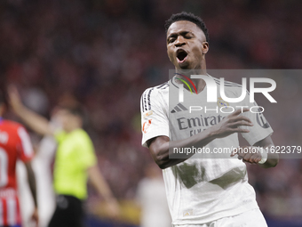 Vinicius Jr of Real Madrid reacts to a missed opportunity during the La Liga 2024/25 match between Atletico de Madrid and Real Madrid at Civ...