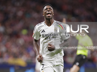 Vinicius Jr of Real Madrid reacts to a missed opportunity during the La Liga 2024/25 match between Atletico de Madrid and Real Madrid at Civ...