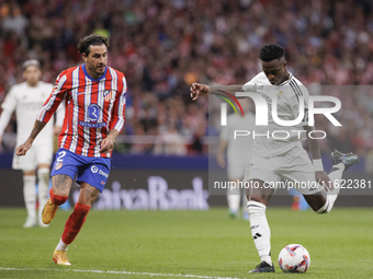 Vinicius Jr of Real Madrid is in action during the La Liga 2024/25 match between Atletico de Madrid and Real Madrid at Civitas Metropolitano...