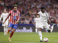 Vinicius Jr of Real Madrid is in action during the La Liga 2024/25 match between Atletico de Madrid and Real Madrid at Civitas Metropolitano...