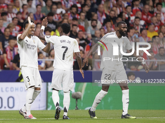 Eder Militao of Real Madrid and Vinicius Jr. of Real Madrid celebrate a goal during the La Liga 2024/25 match between Atletico de Madrid and...