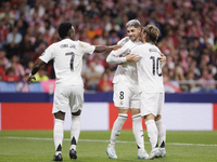 Several players of Real Madrid celebrate a goal during the La Liga 2024/25 match between Atletico de Madrid and Real Madrid at Civitas Metro...