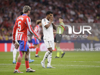 Rodrygo Goes of Real Madrid reacts to a missed opportunity during the La Liga 2024/25 match between Atletico de Madrid and Real Madrid at Ci...