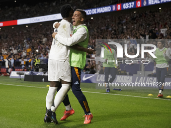 Vinicius Jr. of Real Madrid and Lucas Vazquez of Real Madrid celebrate a goal during the La Liga 2024/25 match between Atletico de Madrid an...