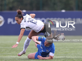 Sarah Wilson of Durham Women upends Tegan McGowan in a tackle during the FA Women's Championship match between Durham Women FC and Birmingha...