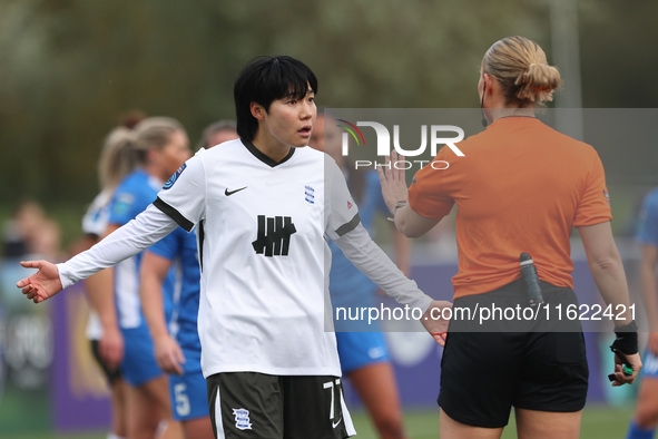 Match referee Lucy May (also known as Lucy Oliver) cautions Geum-Min Lee of Birmingham City Women during the FA Women's Championship match b...