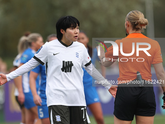 Match referee Lucy May (also known as Lucy Oliver) cautions Geum-Min Lee of Birmingham City Women during the FA Women's Championship match b...