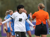 Match referee Lucy May (also known as Lucy Oliver) cautions Geum-Min Lee of Birmingham City Women during the FA Women's Championship match b...