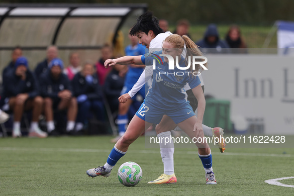 Lily Crosthwaite of Durham Women battles for possession with Geum-Min Lee of Birmingham City Women during the FA Women's Championship match...