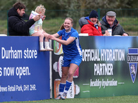 Lily Crosthwaite of Durham Women celebrates with a child spectator after scoring their first goal during the FA Women's Championship match b...