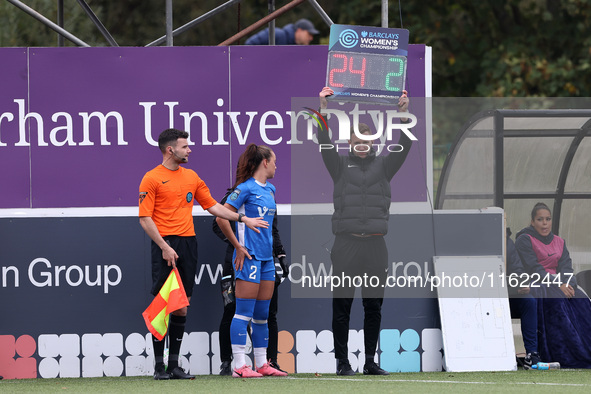 Jon Ashworth-Sears, the fourth official, holds up the Barclays Women Championship branded board to denote a substitution during the FA Women...