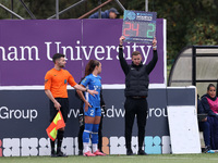 Jon Ashworth-Sears, the fourth official, holds up the Barclays Women Championship branded board to denote a substitution during the FA Women...