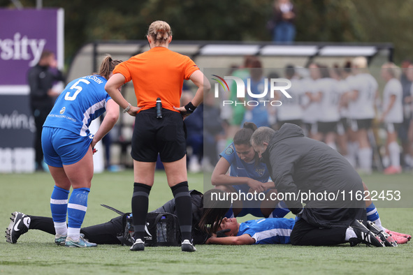 Mollie Lambert receives treatment after a collision with Becky Salicki during the FA Women's Championship match between Durham Women FC and...