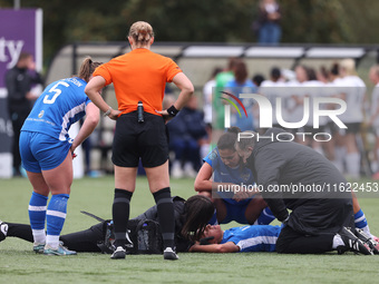 Mollie Lambert receives treatment after a collision with Becky Salicki during the FA Women's Championship match between Durham Women FC and...