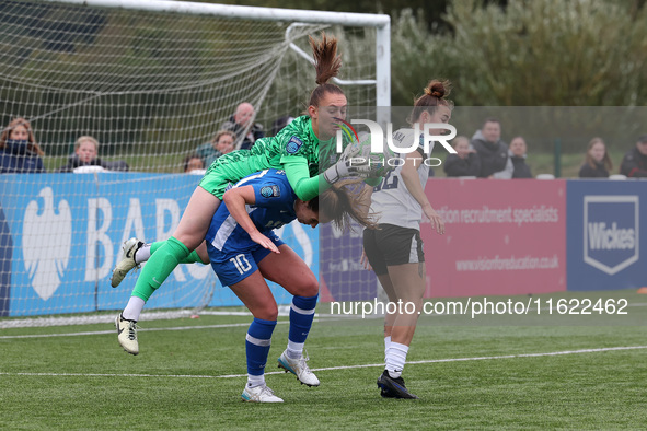 Lucy Thomas of Birmingham City Women lands on Hannah Blake of Durham Women while claiming a cross during the FA Women's Championship match b...