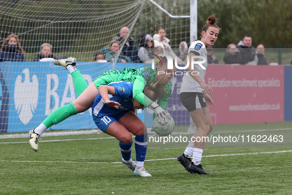 Lucy Thomas of Birmingham City Women lands on Hannah Blake of Durham Women while claiming a cross during the FA Women's Championship match b...