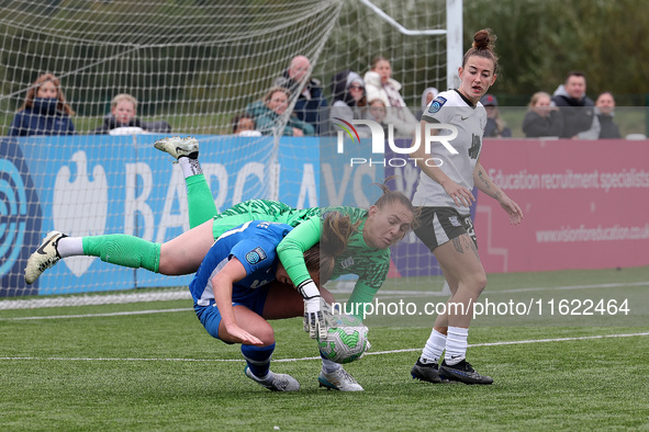 Lucy Thomas of Birmingham City Women lands on Hannah Blake of Durham Women while claiming a cross during the FA Women's Championship match b...