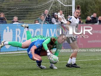 Lucy Thomas of Birmingham City Women lands on Hannah Blake of Durham Women while claiming a cross during the FA Women's Championship match b...