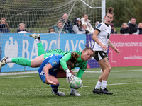 Lucy Thomas of Birmingham City Women lands on Hannah Blake of Durham Women while claiming a cross during the FA Women's Championship match b...