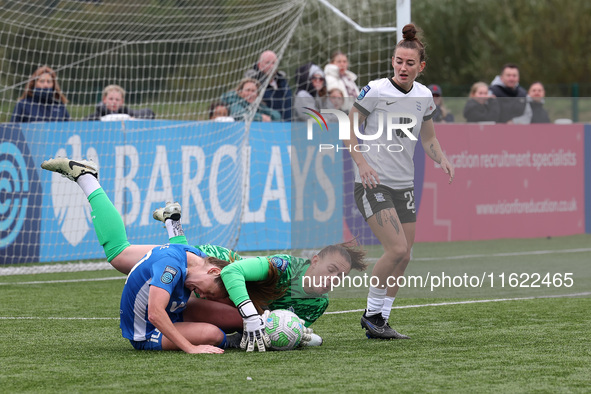 Lucy Thomas of Birmingham City Women lands on Hannah Blake of Durham Women while claiming a cross during the FA Women's Championship match b...