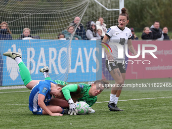 Lucy Thomas of Birmingham City Women lands on Hannah Blake of Durham Women while claiming a cross during the FA Women's Championship match b...