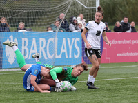 Lucy Thomas of Birmingham City Women lands on Hannah Blake of Durham Women while claiming a cross during the FA Women's Championship match b...