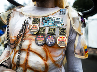 A soapbox racer wears several Red Bull event pins during the Red Bull Balineras race, a soapbox race that returns after 12 years, in Bogota,...