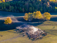 Tourists watch a Ten Thousand Steeds Gallop performance at Ulan Butong Grassland in Chifeng, China, on September 25, 2024. (