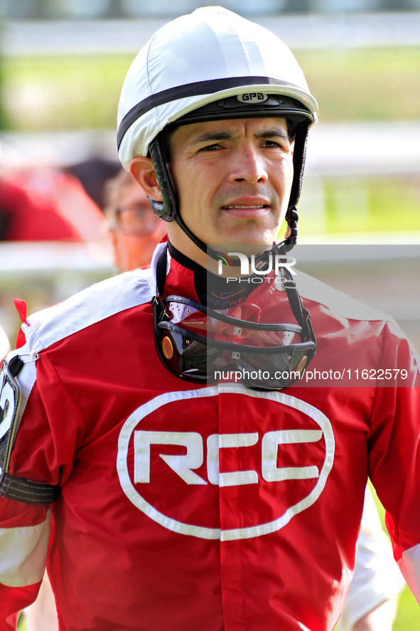 Jockey Eswan Flores returns from the track following the sixth race at Woodbine Racetrack in Toronto, Canada, on September 29, 2024. 