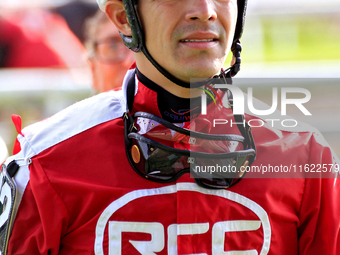 Jockey Eswan Flores returns from the track following the sixth race at Woodbine Racetrack in Toronto, Canada, on September 29, 2024. (