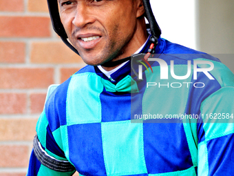 Jockey Patrick Husbands leaves the paddock ahead of the seventh race at Woodbine Racetrack in Toronto, Canada, on September 29, 2024. (