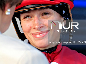 Jockey Sofia Vives smiles while talking to connections after the seventh race at Woodbine Racetrack in Toronto, Canada, on September 29, 202...