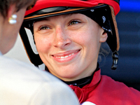 Jockey Sofia Vives smiles while talking to connections after the seventh race at Woodbine Racetrack in Toronto, Canada, on September 29, 202...