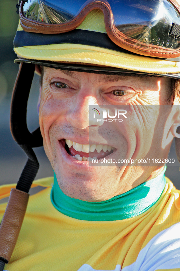 Jockey Justin Stein laughs while celebrating in the winner's circle after riding Roscar to a win in the 134th running of the $400,000 Breede...