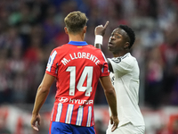 Vinicius Junior left winger of Real Madrid and Brazil and   Marcos Llorente central midfield of Atletico de Madrid and Spain argues during t...