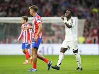 Vinicius Junior left winger of Real Madrid and Brazil and   Marcos Llorente central midfield of Atletico de Madrid and Spain argues during t...