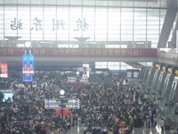 Passengers wait at the waiting hall of Hangzhou East Railway Station in Hangzhou, China, on September 30, 2024. On the day before the Nation...