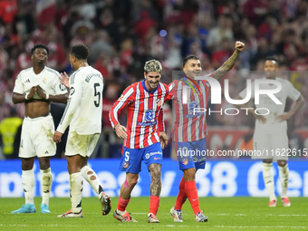 Angel Correa right winger of Atletico de Madrid and Argentina celebrates after scoring his sides first goal during the LaLiga match between...