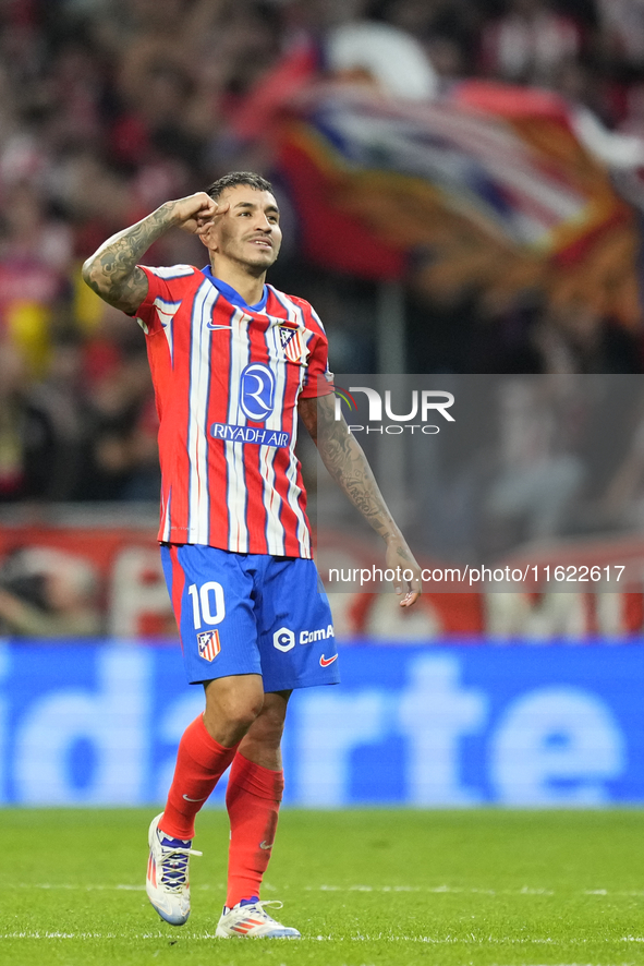 Angel Correa right winger of Atletico de Madrid and Argentina celebrates after scoring his sides first goal during the LaLiga match between...