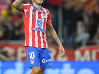 Angel Correa right winger of Atletico de Madrid and Argentina celebrates after scoring his sides first goal during the LaLiga match between...