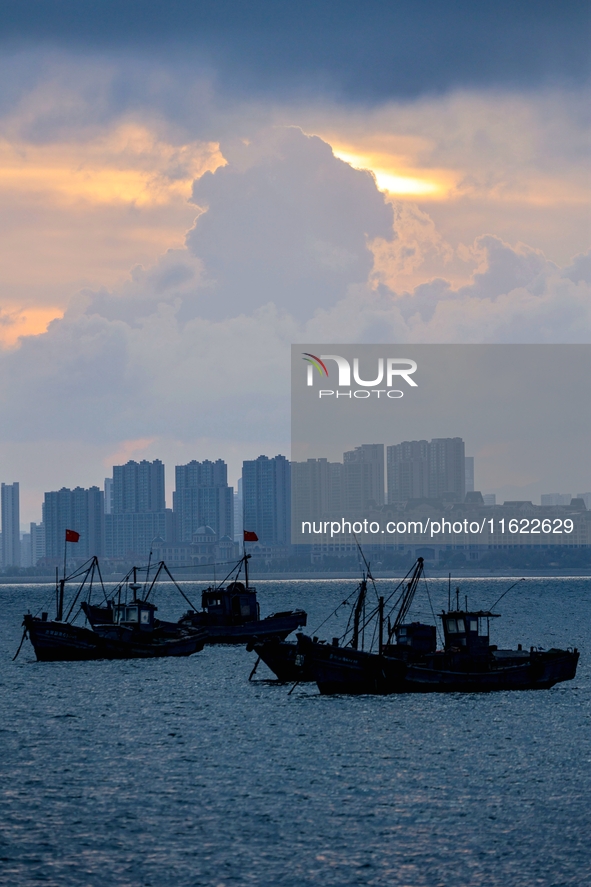 Fishing boats return to the coast of Gujia Island, a new area on the west coast of Qingdao, Shandong province, China, on September 29, 2024....