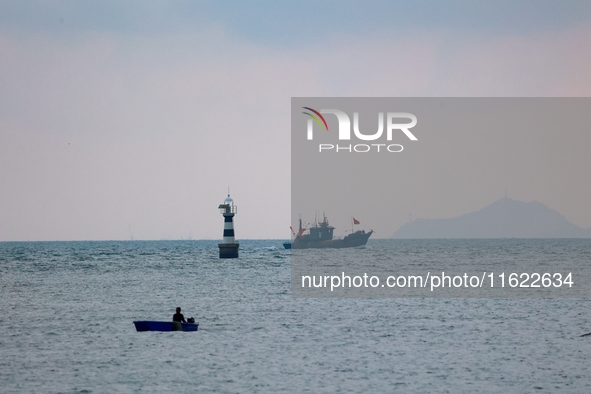 Fishing boats return to the coast of Gujia Island, a new area on the west coast of Qingdao, Shandong province, China, on September 29, 2024....