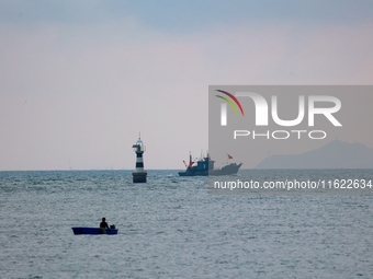 Fishing boats return to the coast of Gujia Island, a new area on the west coast of Qingdao, Shandong province, China, on September 29, 2024....