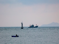 Fishing boats return to the coast of Gujia Island, a new area on the west coast of Qingdao, Shandong province, China, on September 29, 2024....