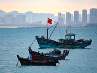 Fishing boats return to the coast of Gujia Island, a new area on the west coast of Qingdao, Shandong province, China, on September 29, 2024....