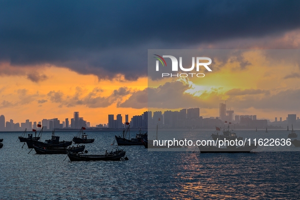 The sunset shines on the beach of Gujia Island in the West Coast New Area of Qingdao, Shandong province, China, on September 29, 2024. 