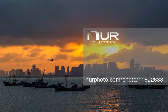 The sunset shines on the beach of Gujia Island in the West Coast New Area of Qingdao, Shandong province, China, on September 29, 2024. 