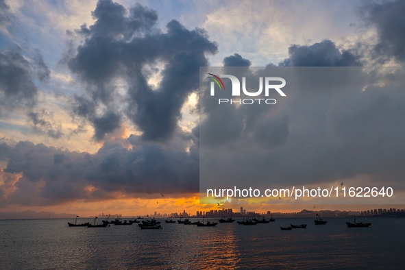 The sunset shines on the beach of Gujia Island in the West Coast New Area of Qingdao, Shandong province, China, on September 29, 2024. 